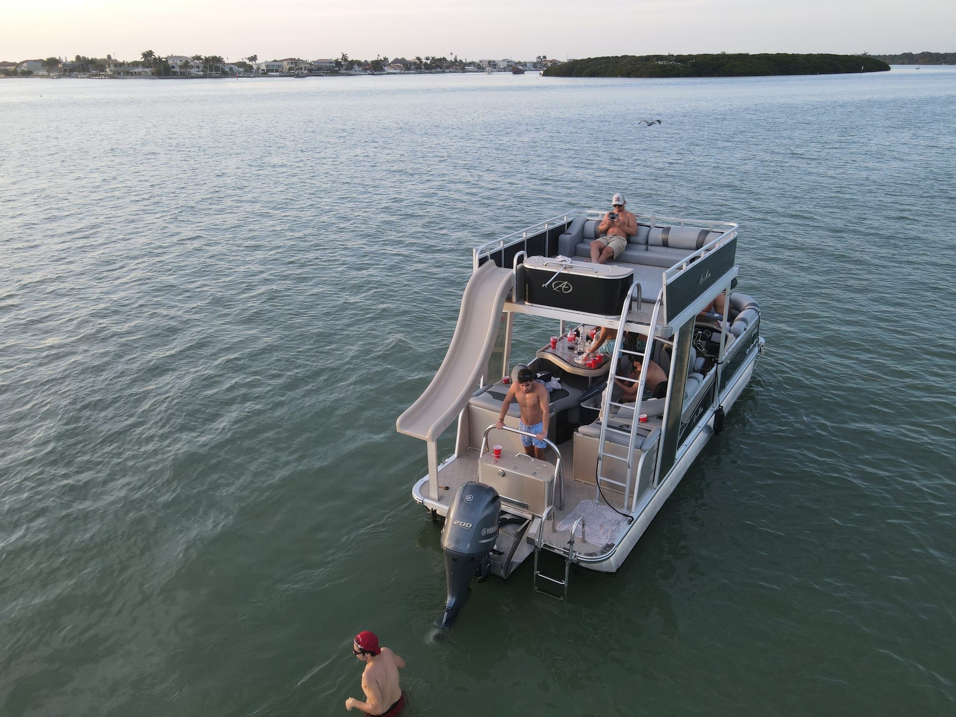 Avalon Funship with waterslide at sunset