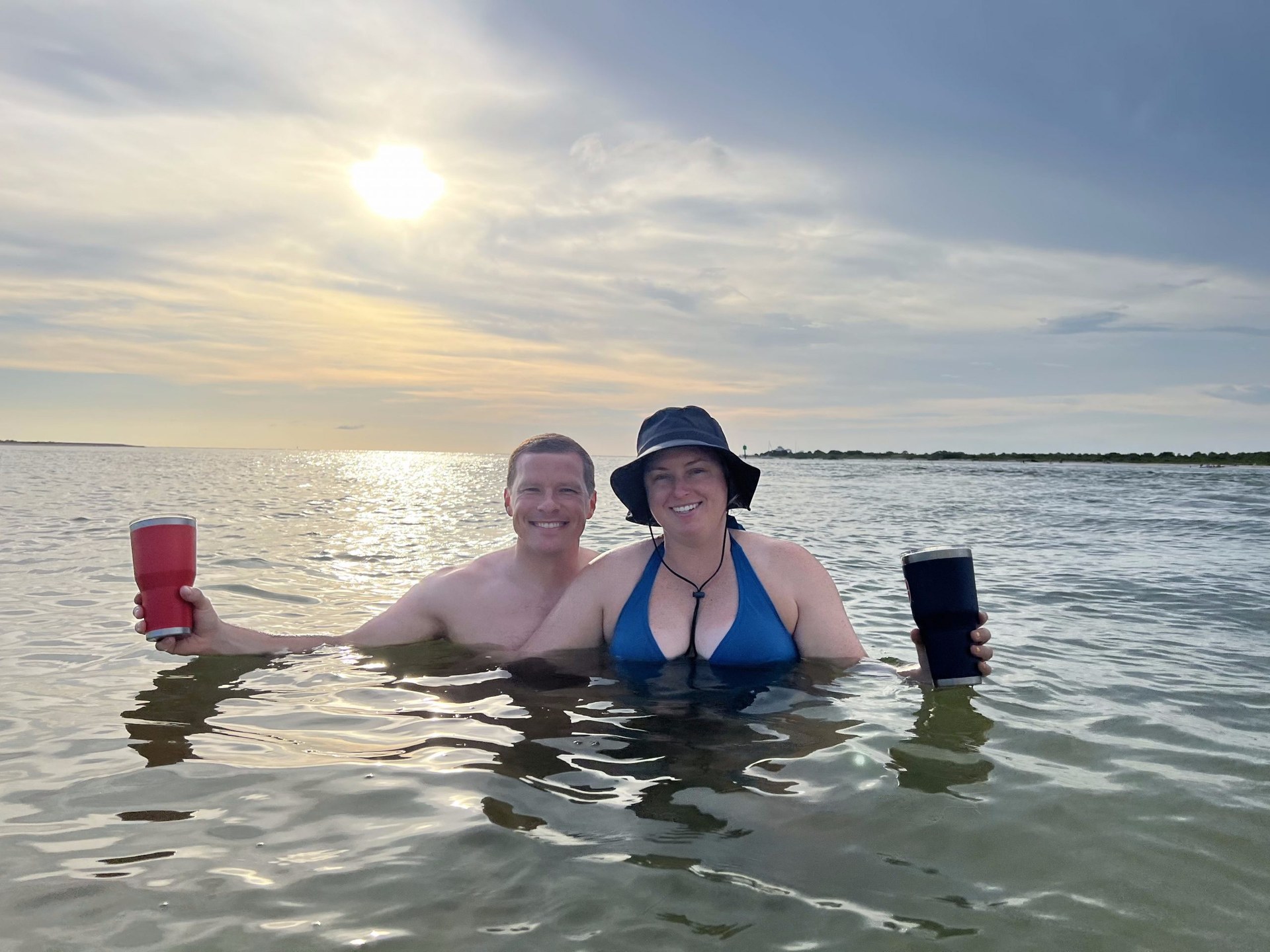 Couple enjoying sunset in the water